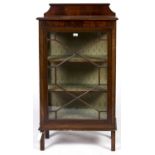 An Edwardian mahogany display cabinet in George III style, c1910, figured upstand and frieze
