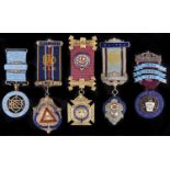 Three masonic silver gilt and enamel jewels and two other fraternal society silver gilt and enamel