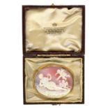 A gold cameo brooch,  the oval shell carved with Venus and putti, mounted in gold, 41mm l,  in a