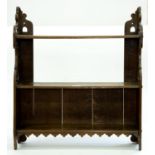 A set of oak hanging shelves, first half 20th c, with shaped fretwork sides, 64cm h; 15 x 58cm