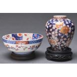 A Japanese Fukagawa bowl and blue ground jar, Meiji period, bowl 18cm diam and wood stands (4)