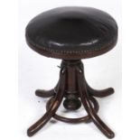 A bentwood piano stool, c1900, cast iron helix, 46cm h, bearing fragmentary label Circular stretcher