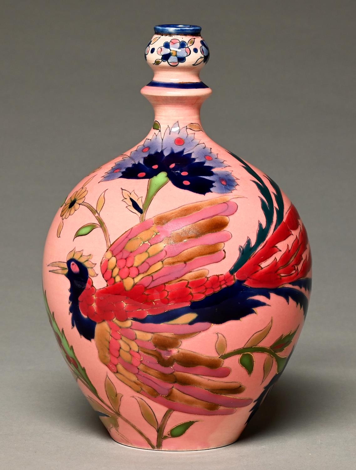A Zsolnay ewer, c1880, decorated in the Magyar-Turkish style with a long tailed bird, tulips and