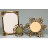 Three brass photograph frames, early 20th c, one set with amethyst pastes, the larger circular