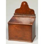 An oak and fruitwood wall hanging candle box, 19th c, the sloping lid secured by brass studded