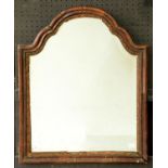 A walnut mirror, late 19th c, in George II style, the carved and gilded slip in breakarched frame,