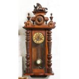 A walnut Vienna wall clock, c1900, with painted composition rearing horse finial, gridiron pendulum,