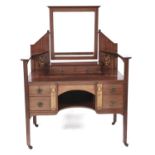 A Liberty style inlaid mahogany dressing table, late 19th c, the central bevelled plate supported by