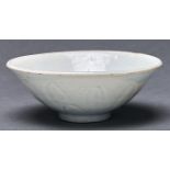 A Chinese Longquan celadon bowl, Song Dynasty, with combed or carved petal detail, on flat