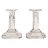 A pair of Edward VII silver dwarf columnar candlesticks, 10.5cm h, by R & W Sorley, Sheffield 1907