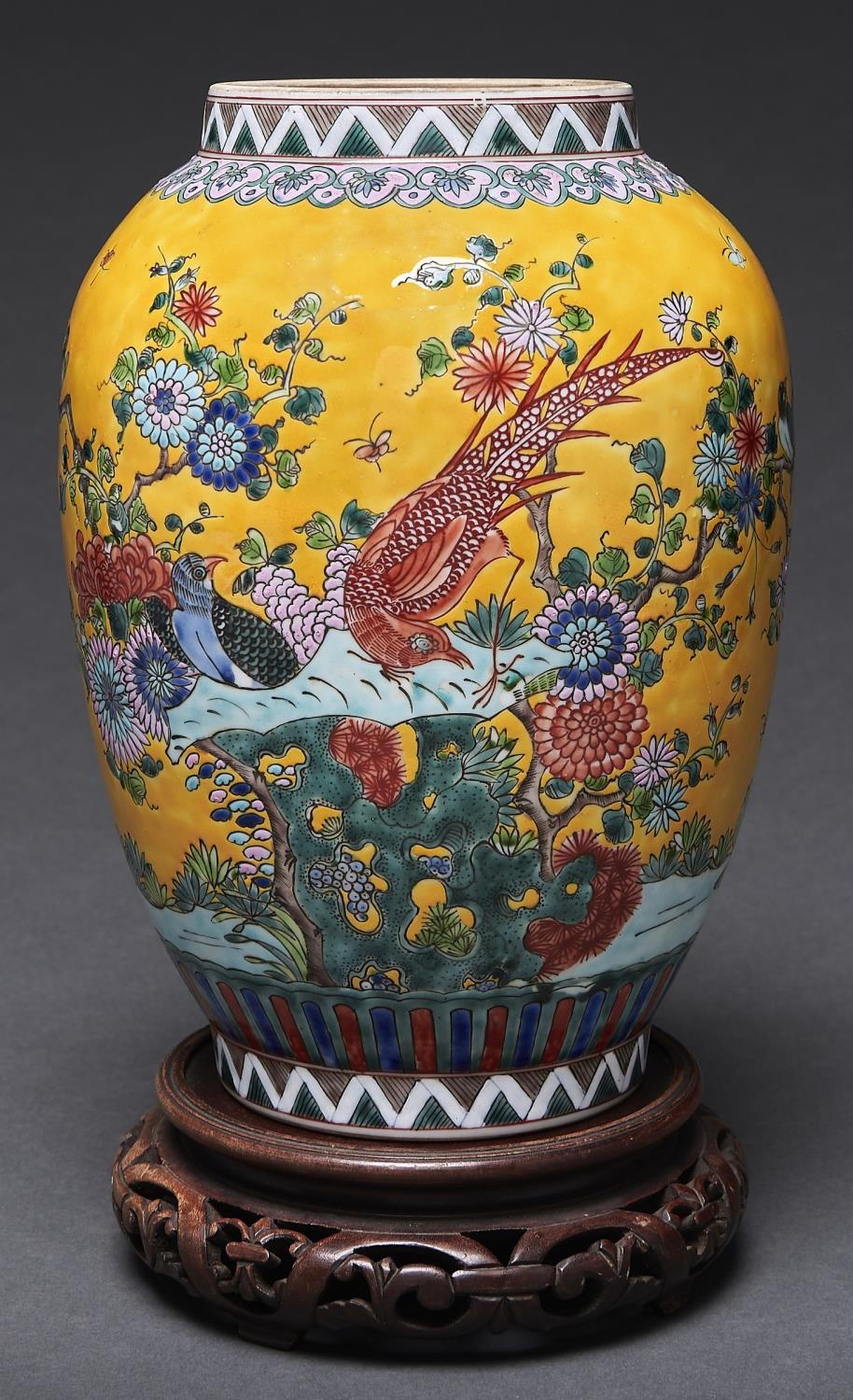 A Chinese yellow ground famille rose jar, enamelled with birds, flowering chrysanthemum and lotus,