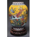 A Chinese yellow ground famille rose jar, enamelled with birds, flowering chrysanthemum and lotus,