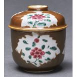 A Chinese Batavian covered bowl, Qing dynasty, enamelled with a flower in three leaf shaped