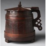 An English oak and ash 'York' tankard, probably 17th c, of tapered form with staved construction