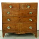 A Regency mahogany chest of drawers, outlined with satinwood crossbands, boxwood and ebony