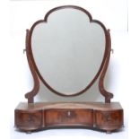 An Edwardian mahogany dressing table mirror in George III style, c1905, the shield shaped plate on