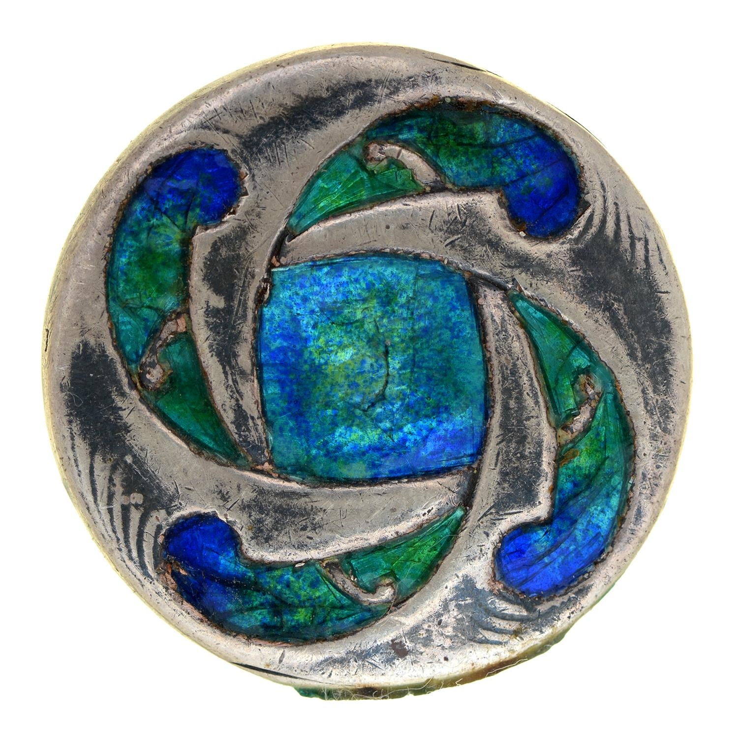 Liberty & Co. A silver and translucent enamel button, the design attributed to Archibald Knox,
