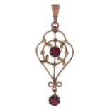 A red paste set openwork pendant, early 20th c, in gold marked 9ct, 1.1g Light wear