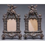 A pair of ornate Victorian bronzed iron photograph frames, c1890, with hinged strut, marked RD No