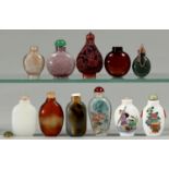 A gold coloured metal mounted jade scent bottle and ten Chinese glass, agate and porcelain snuff