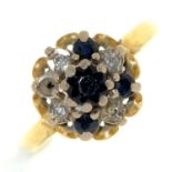 A sapphire and diamond cluster ring, in 18ct gold, date letter rubbed, 3.8g, size K