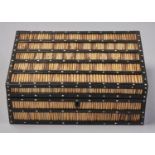 An Indian ebony and porcupine quill box, late 19th c, the frame inlaid with ivory dots, 27cm l