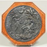 A silver plated electrotype plaque of Adam and Eve, late 19th c, 25.5cm diam, octagonal oak mount