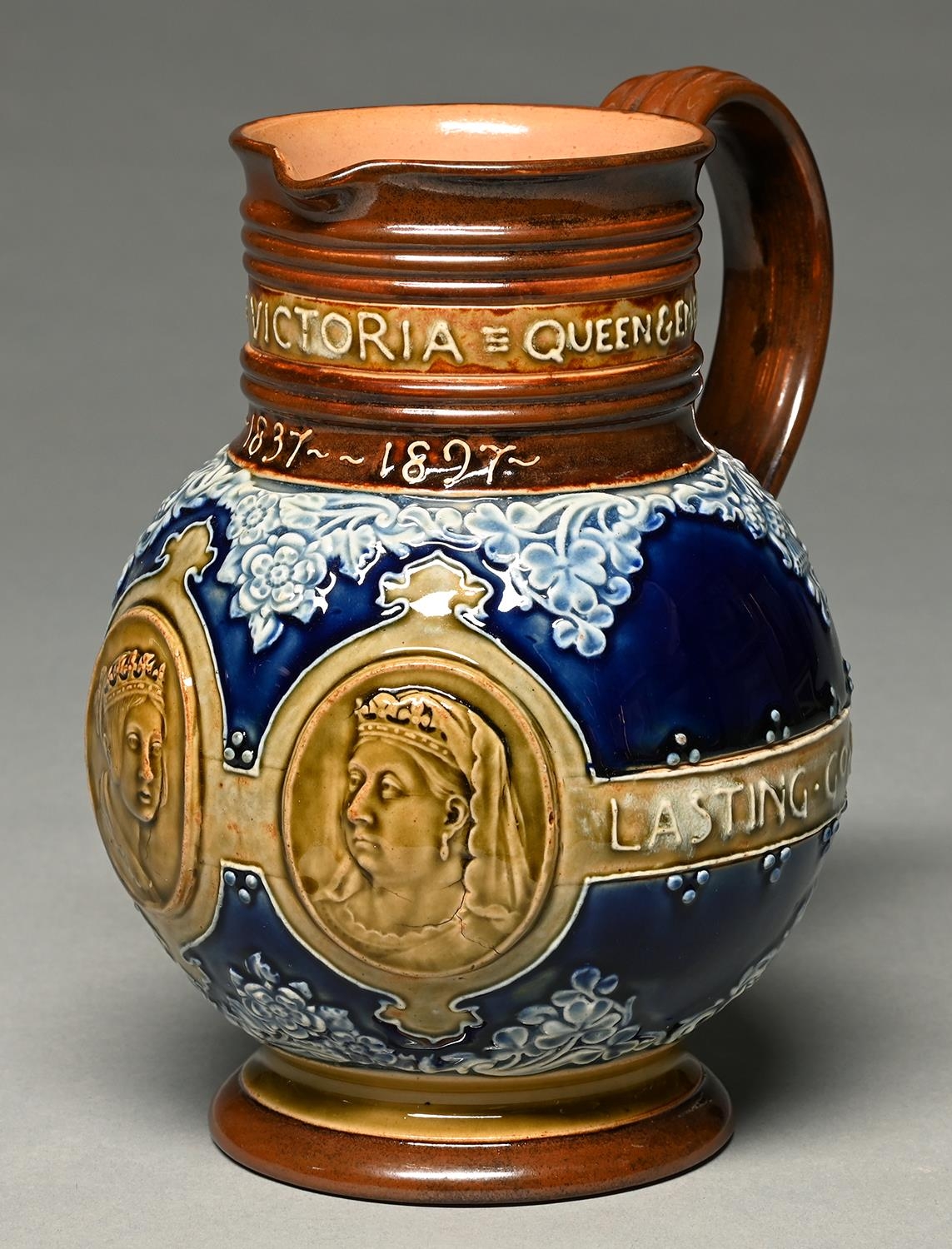 Royal Diamond Jubilee, 1897. A Doulton ware commemorative jug, moulded with portraits of  Queen