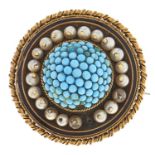 A Victorian turquoise and split pearl target brooch, c1880, in gold, locket back, 15.7g One pearl