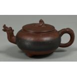 A Chinese Yixing stoneware teapot and cover, with zoomorphic spout, 90mm h, round seal Teapot in