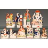 Seven Staffordshire flatback earthenware spill holder figures and groups and three contemporary