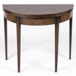 A mahogany D-shaped tea table, in George III style, late 19th c, the hinged top above deep figured