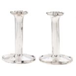 A pair of George V silver dwarf candlesticks, on dished foot, 12cm h, by A & J Zimmermann,