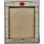 A Chinese jade mounted photograph frame, 1930's, the pierced and carved green stone inset sides with