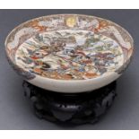 A Japanese Satsuma bowl, Meiji period, decorated with a battle scene, the border with confronting