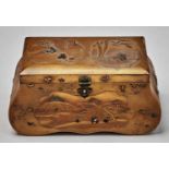 A Japanese gold lacquer bag form casket, Meiji period, with travellers in an extensive landscape and