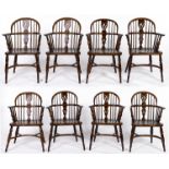 A set of eight reproduction yew wood low back Windsor elbow chairs, late 20th c, pierced splats,