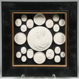 A plaster cameo of Lord Byron and a collection of smaller plaster casts of antique and later gems,
