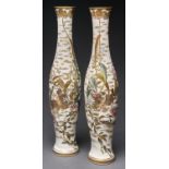 A pair of Japanese Satsuma vases, Meiji period, of attenuated, slender form, decorated with quail