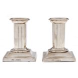 A pair of Victorian silver dwarf columnar candlesticks, nozzles, 90mm h, by Jane Brownett, London