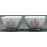 A pair of Chinese porcelain bowls, painted in pale rose enamel with egret roundels, 60mm h, Qianlong