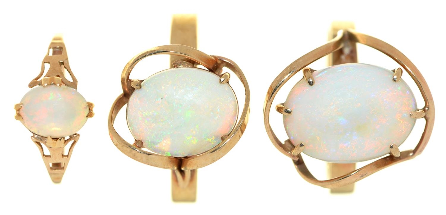Three opal rings, in gold, one marked 9ct, 7g, size E, L and O Good condition