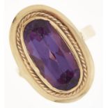 A synthetic colour change sapphire ring, in gold marked 585, 7.4g, size P Good condition