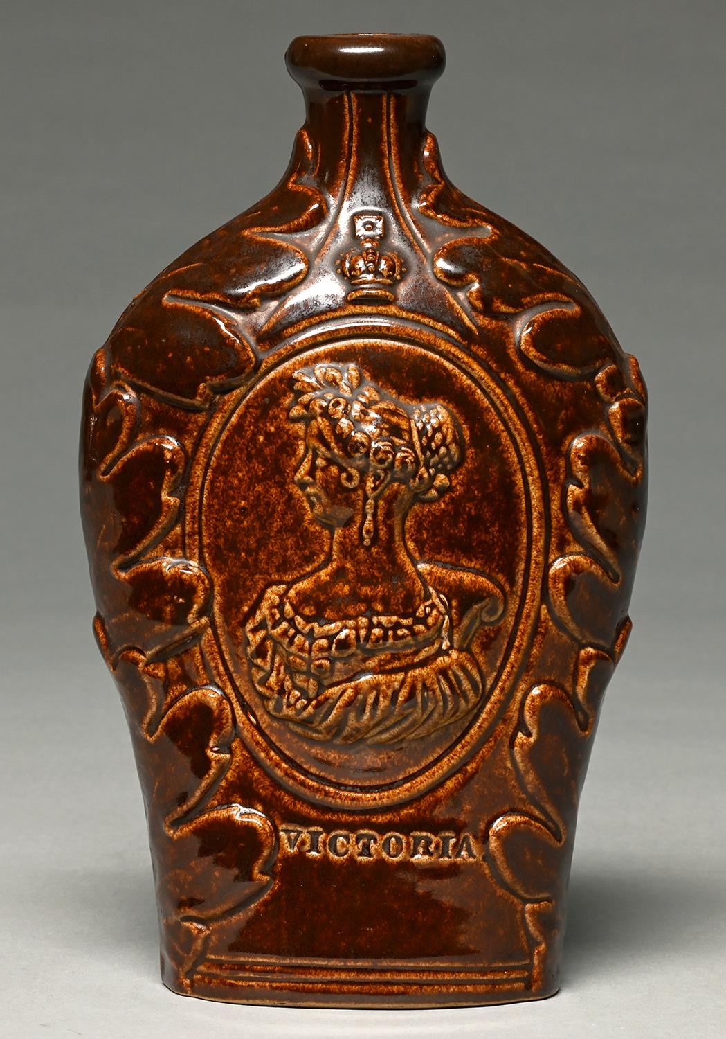 A saltglazed brown stoneware flask,  probably Derbyshire or Yorkshire, c1837,  moulded to either