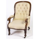 A Victorian mahogany armchair, with padded arms and buttoned upholstery, seat height 36cm Old repair