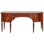 A George IV mahogany sideboard, line inlaid throughout and fitted with an arrangement of drawers and