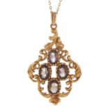 A citrine pendant, in 9ct gold, of scrolling openwork design, on a gold necklet, 6.4g Good