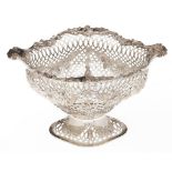 A Victorian silver fruit basket, of ogee shape, die stamped and applied with flowers and festoons