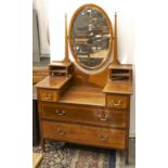 An Edwardian mahogany and line inlaid dressing table, with oval mirror, brass finials and handles,