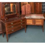 An Edwardian mahogany and broken line inlaid dressing chest, on pottery castors